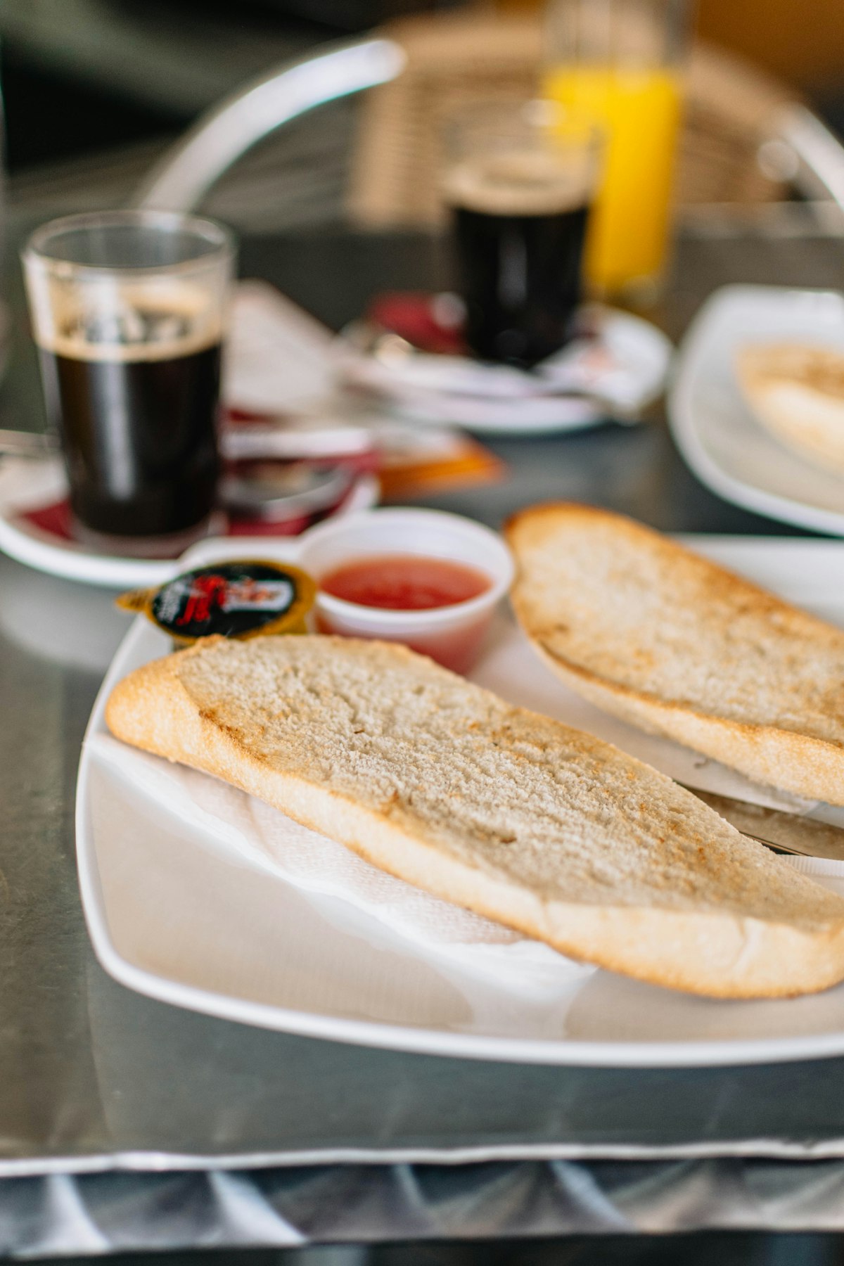 Breakfast of toast, jam, and coffee