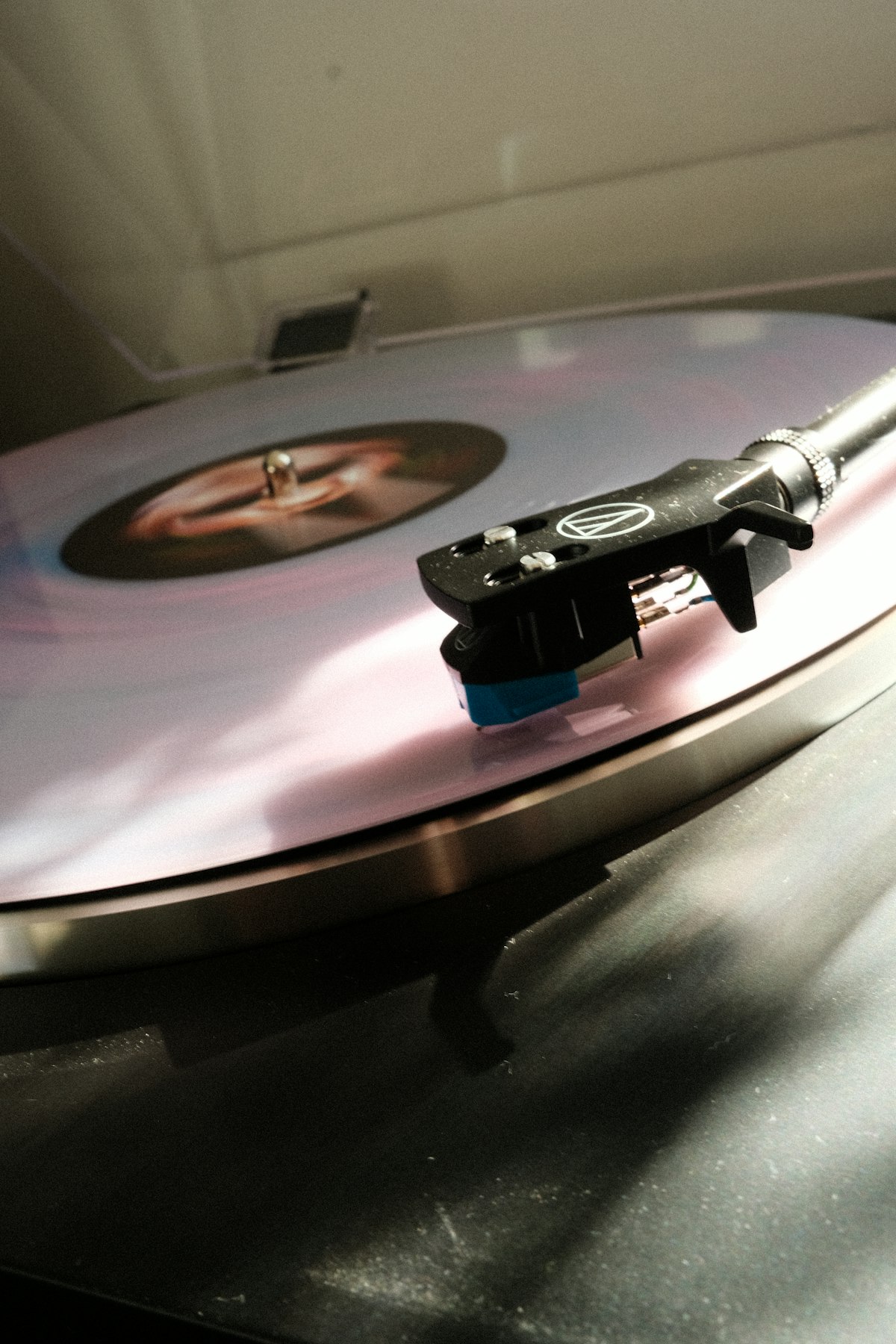 Turntable needle playing a vinyl record