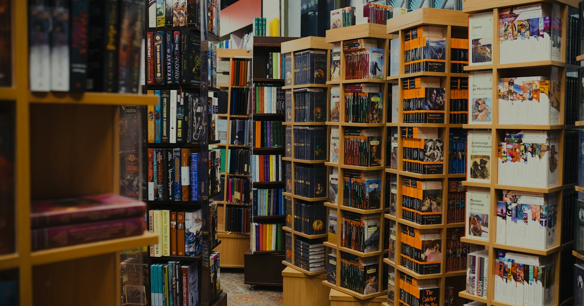 Rows of books on shelves in a bookstore
