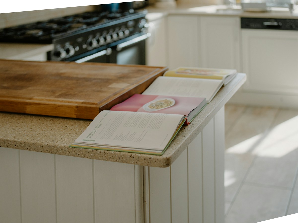 Open cookbooks on a kitchen counter